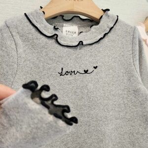 Gray tee with word love on it with ruffle at neckline